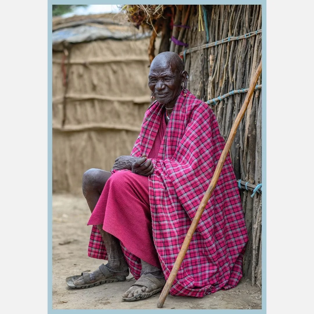 I motioned to this man while visiting his village in Tanzania.  I gave him the international sign for "Can I take your picture?" He smiled in agreement.  After I took the picture he motioned for me to come over to him.  I showed him the bac