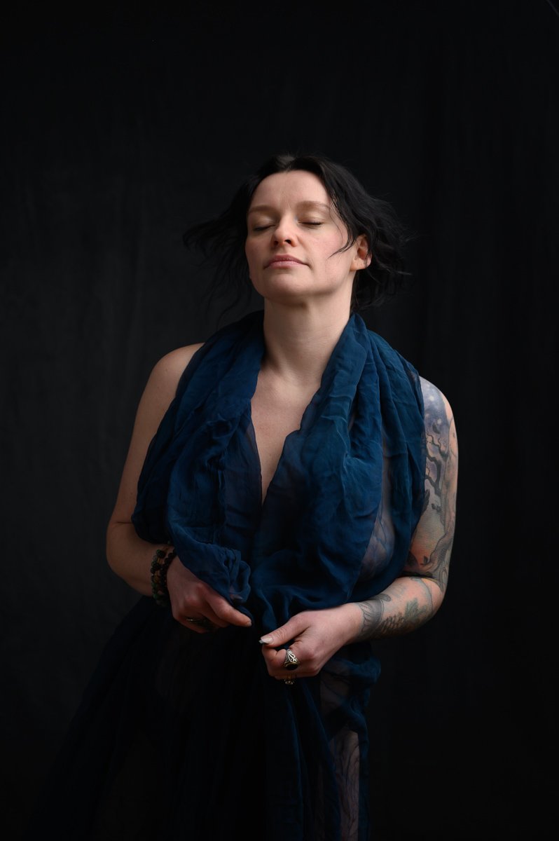 Authentic portrait of a woman reconnecting with confidence during an empowerment photography session