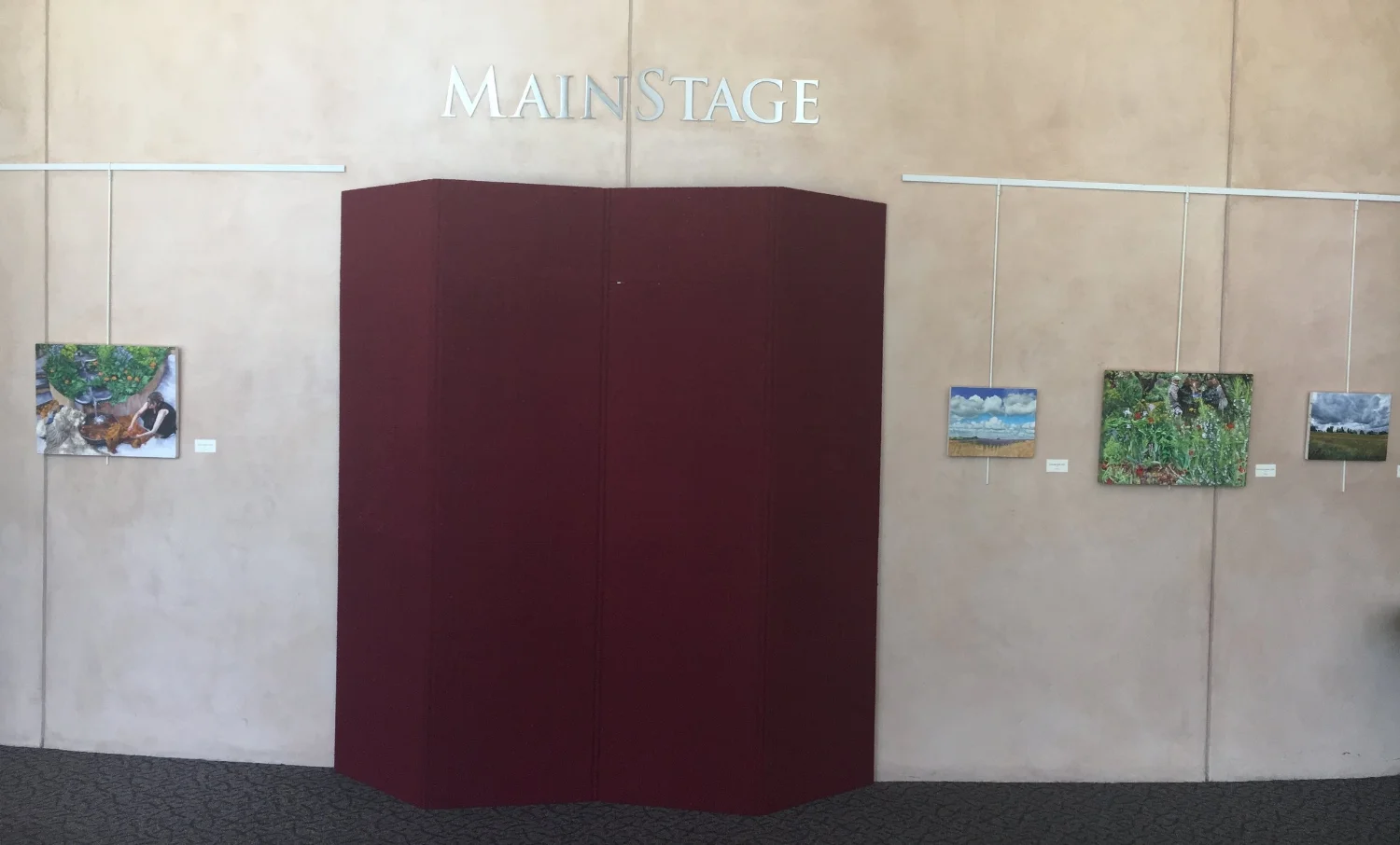 Main Stage entrance door - people in gardens