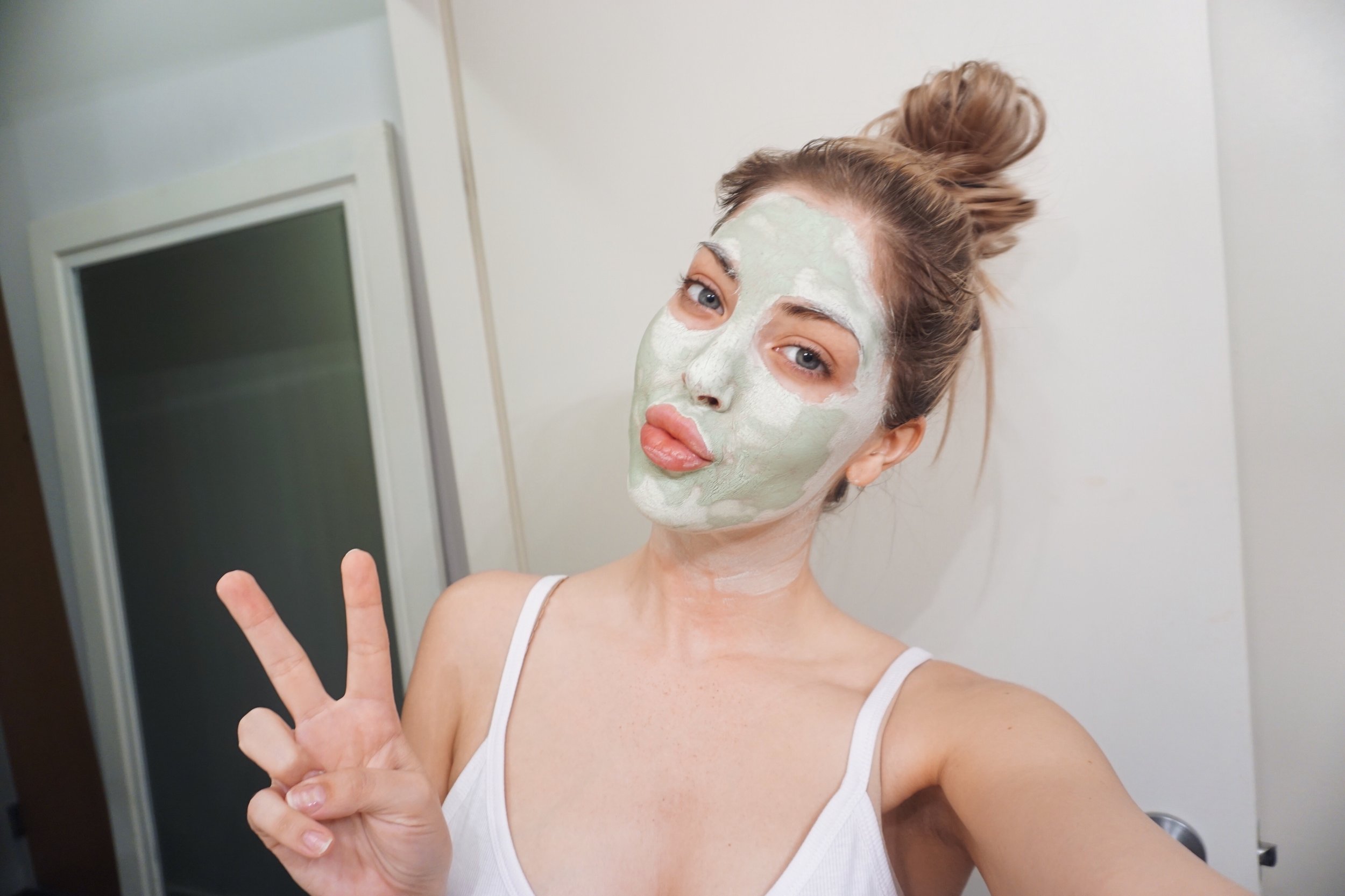 Duck face and peace sign. How original.