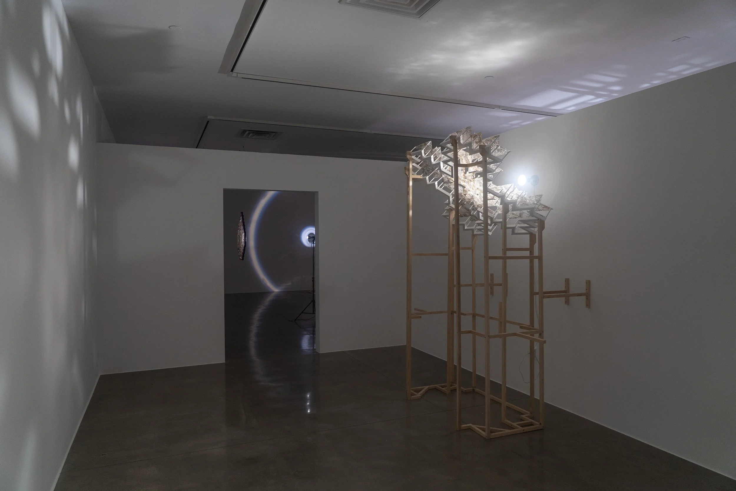   brown archaeoastronomy , 2025, light, mica, ponderosa, acrylic, 93.25x34x76in 