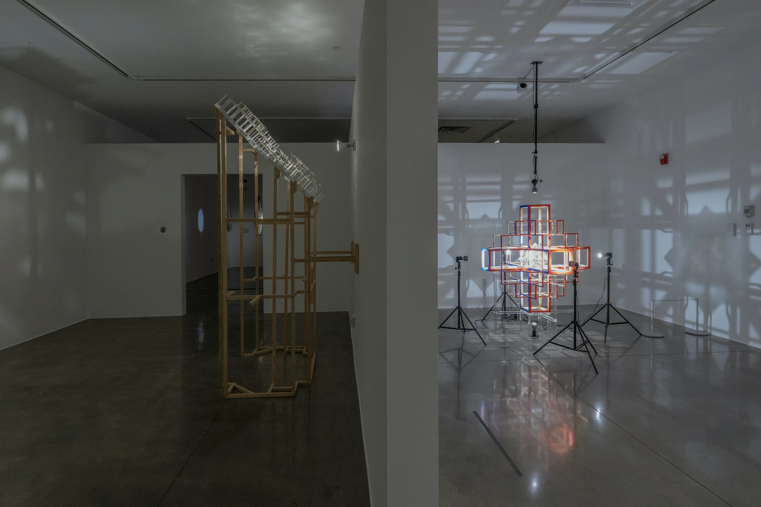  left to right:  brown archaeoastronomy , 2025, light, mica, ponderosa, acrylic, 93.25x34x76in;  photosphere , 2025 