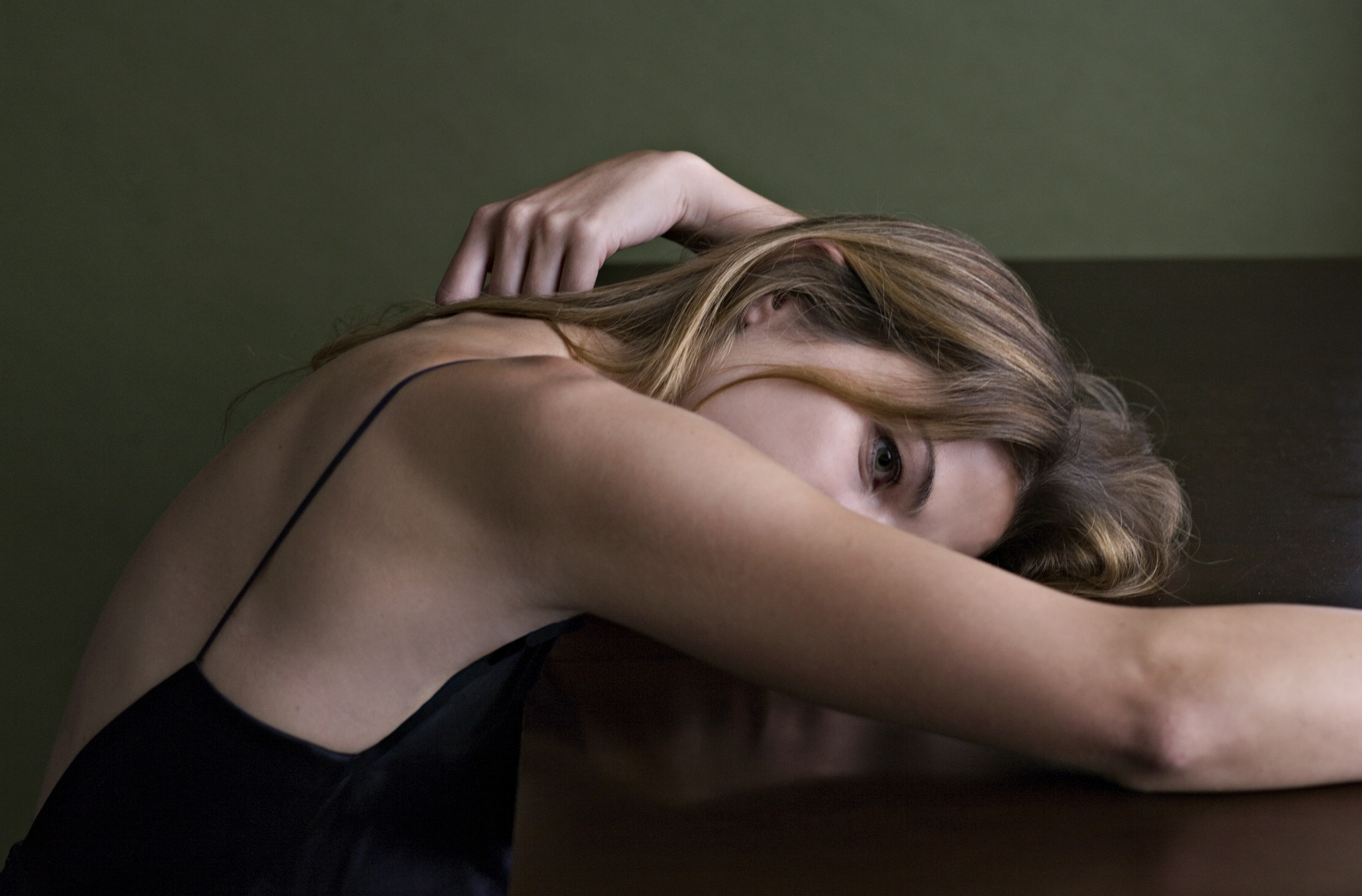 girl resting on table