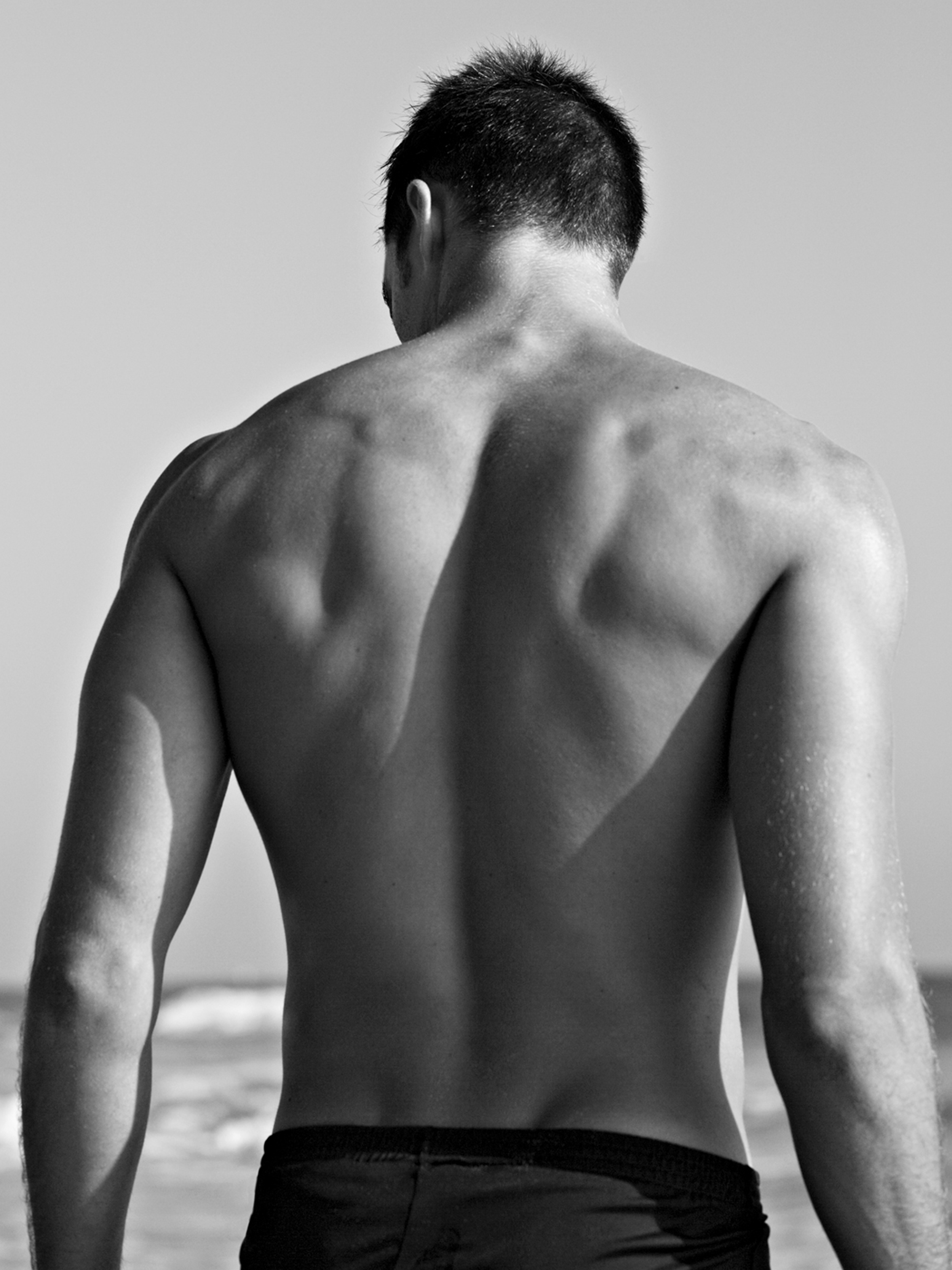 male, rear view