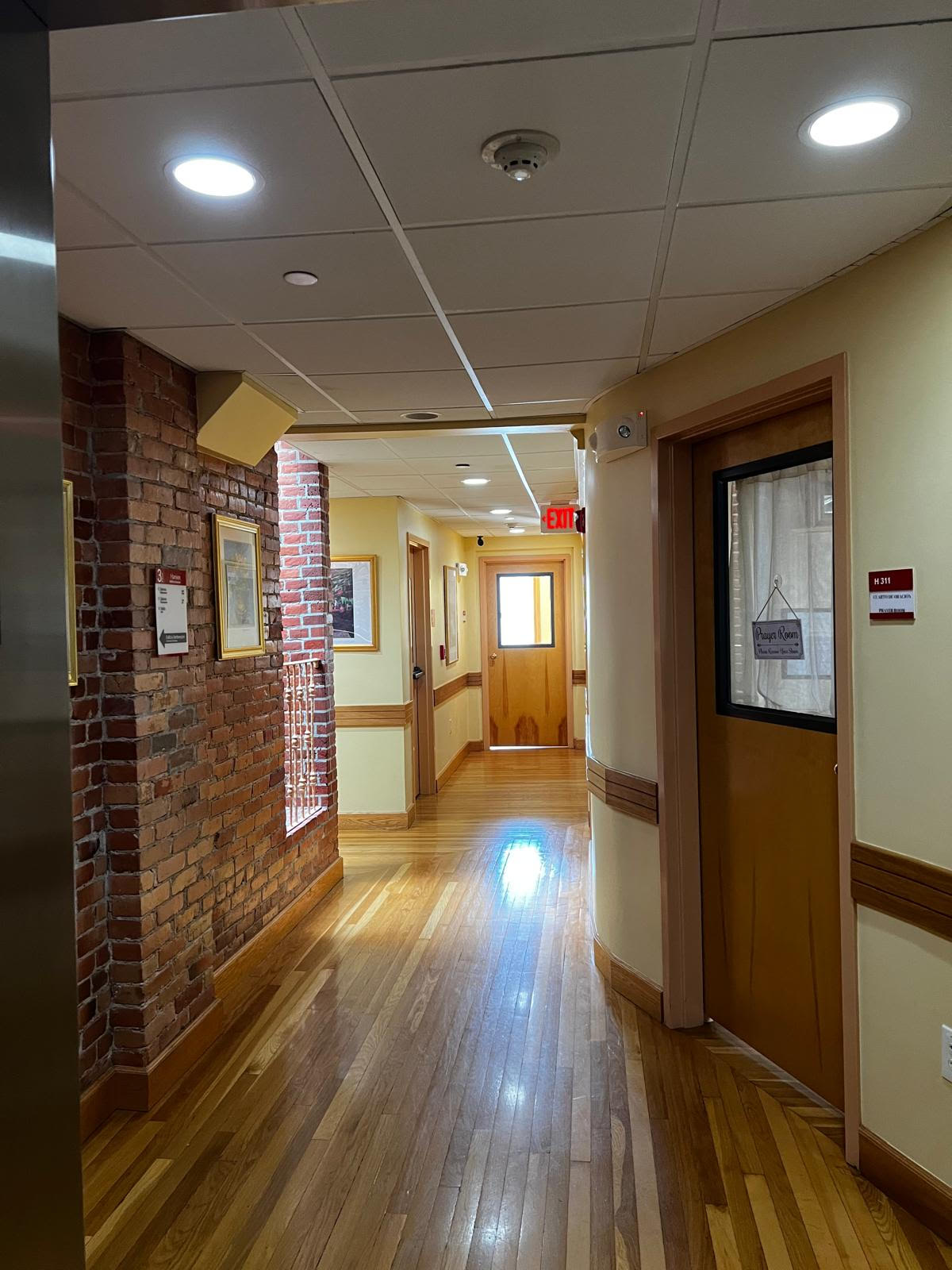 Hallway with entrances to rooms and offices.png