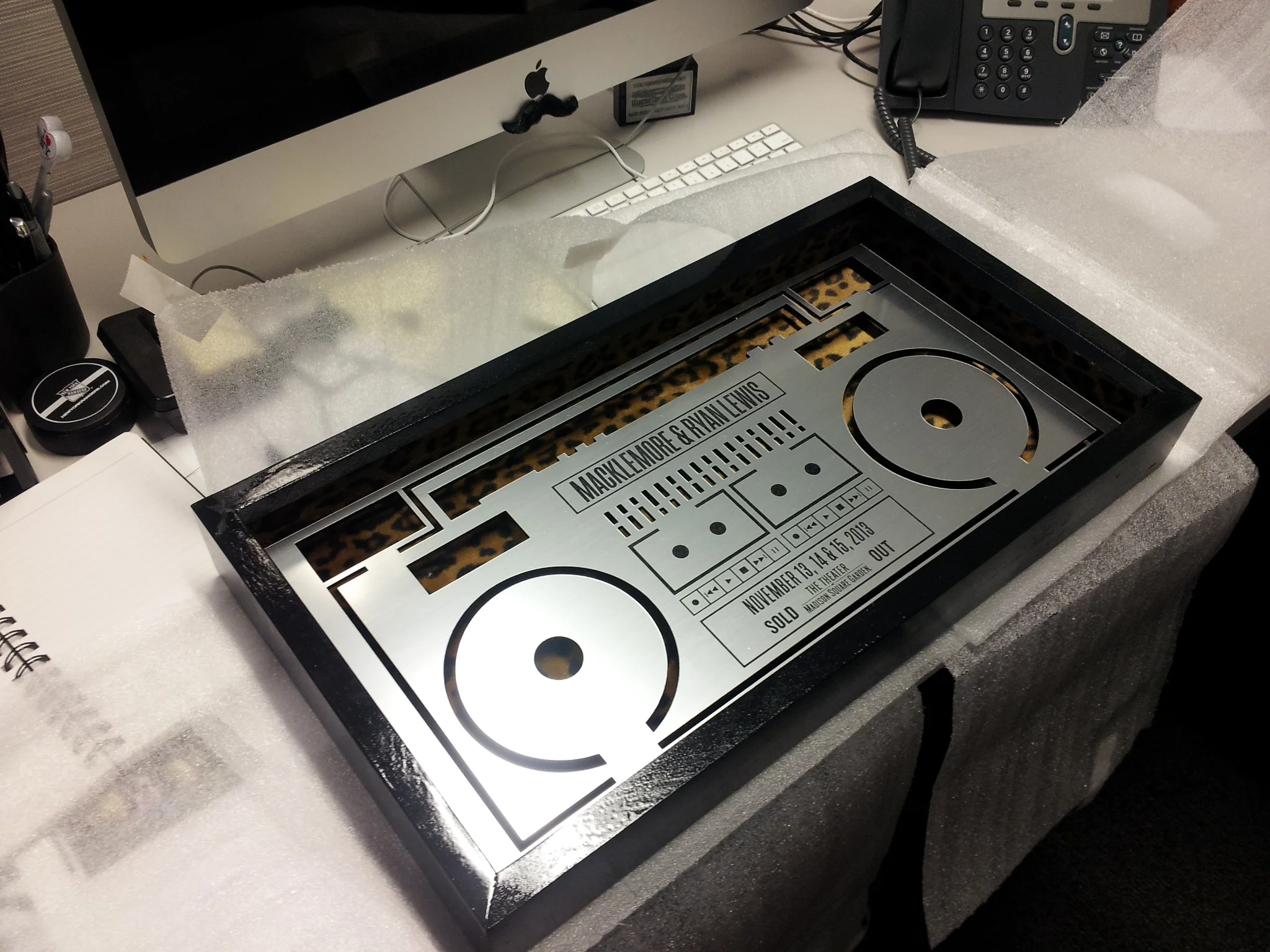 A custom built shadow box with boombox design and leopard print backdrop that was given to Macklemore & Ryan Lewis as a gift for their sold out show run at the Theater at Madison Square Garden in 2013.
