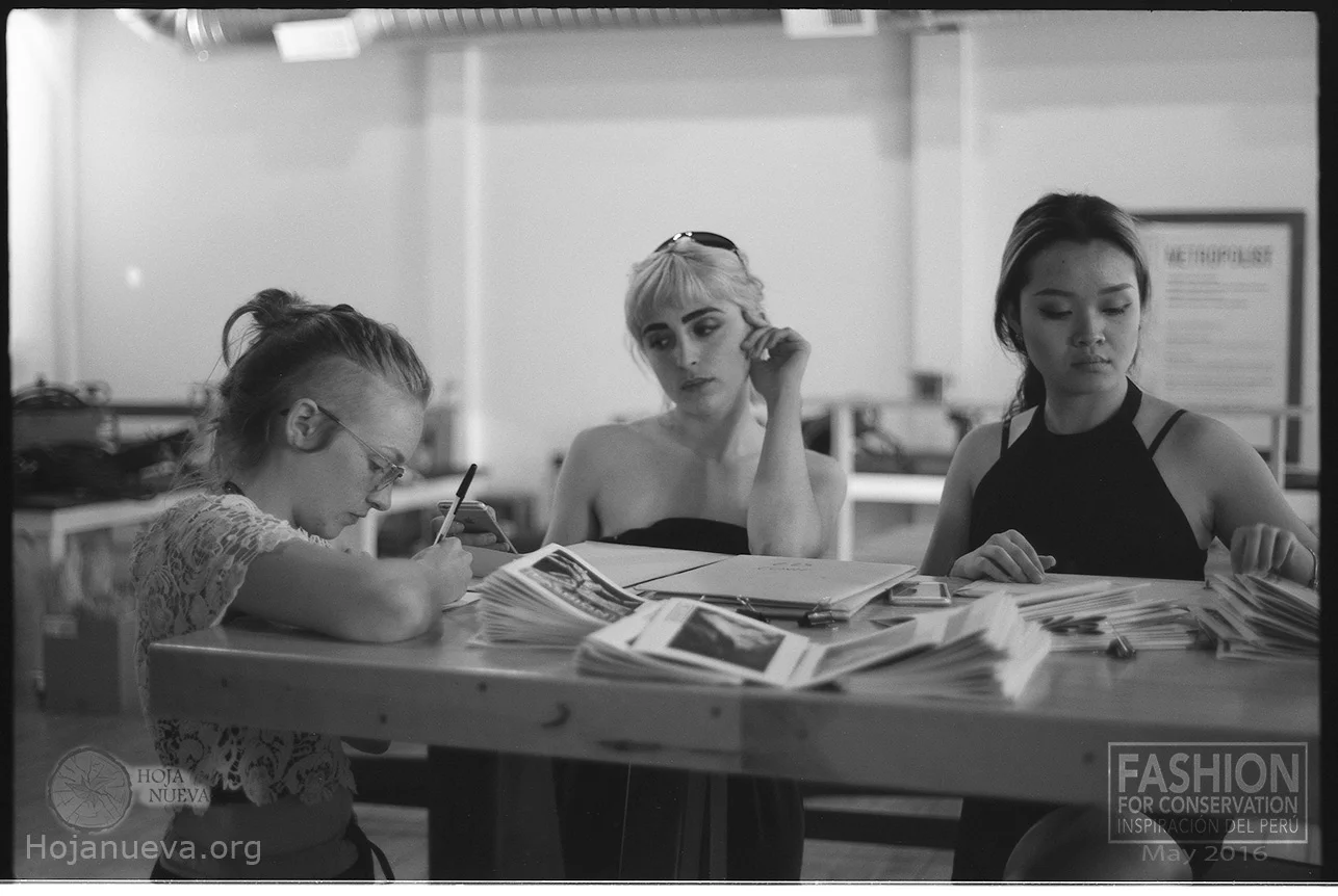 Pictured: Members of the FFC team strategizing behind the scenes of Runway to Peru.