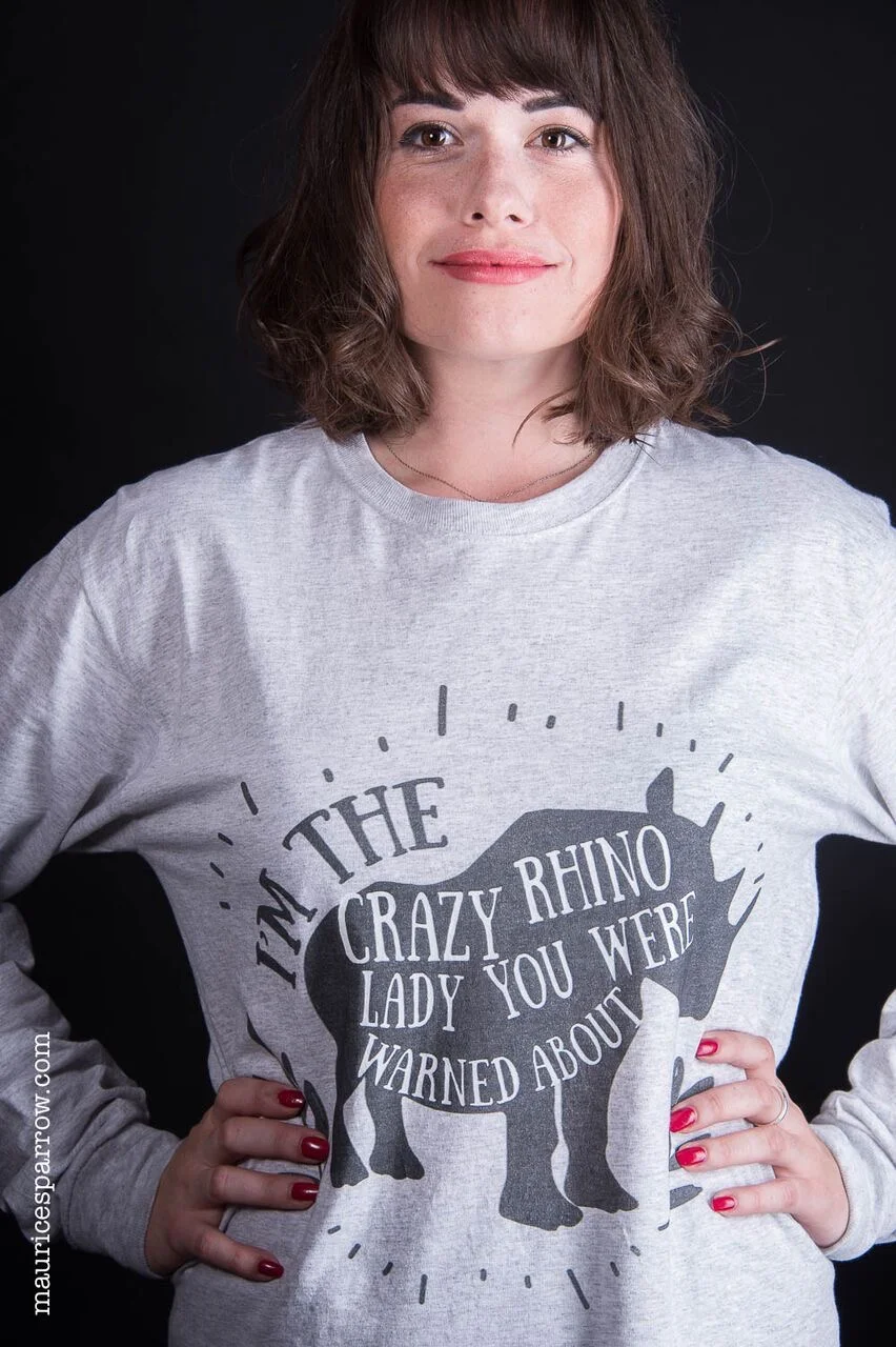 Pictured: Fraser posing in rhino merchandise to support rhino conservation