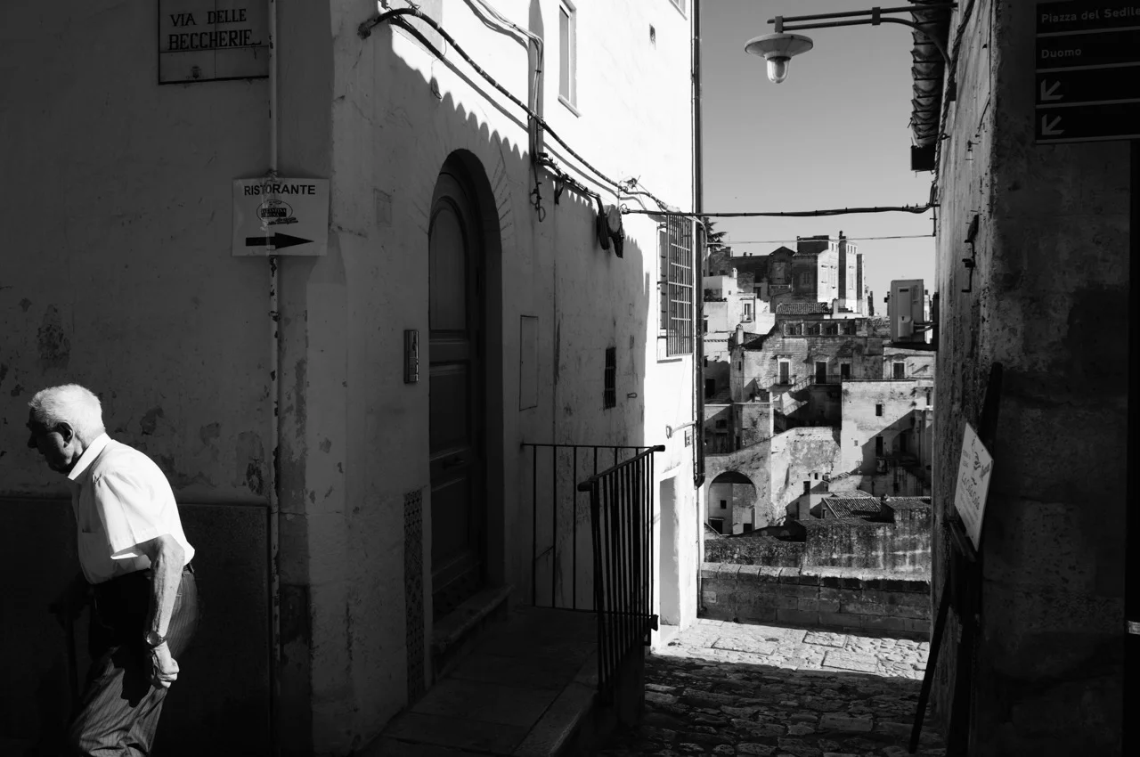 Old man walking in the streets. Matera. Italy. 2016. © Michele Cortina