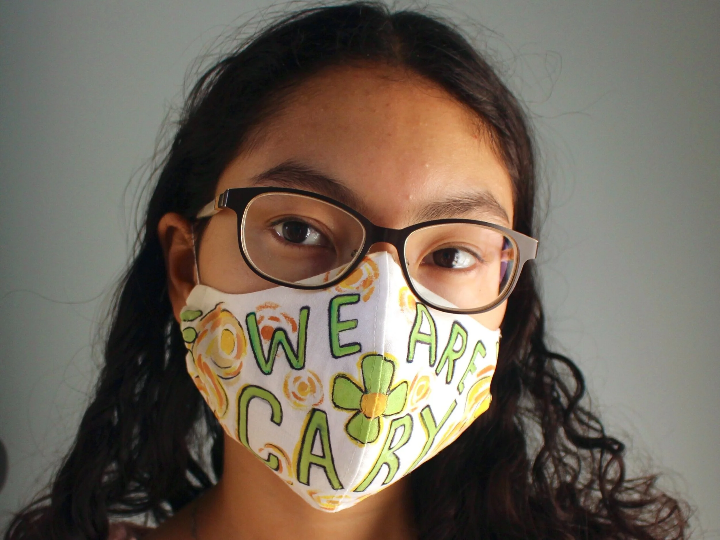 A personalized “We Are Cary” mask from a Green Level High School art student.