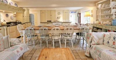 Large kitchen at Gardeners Cottage with farmhouse table seating 12-14