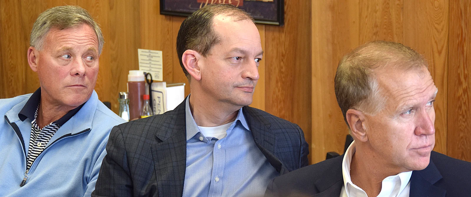 U.S. Sen. Richard Burr, left, U.S. Labor Secretary Alexander Acosta, and U.S. Sen. Thom Tillis