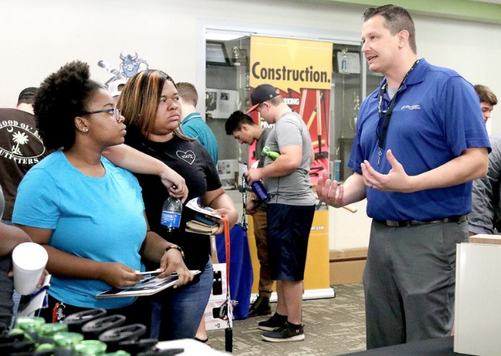 Plant Manager Tony Rogowski of Cornerstone Building Brands explains how his company in Fair Bluff operates to students at the Advanced Manufacturing Job Fair in the Nesmith Student Center at Southeastern Community College Thursday.