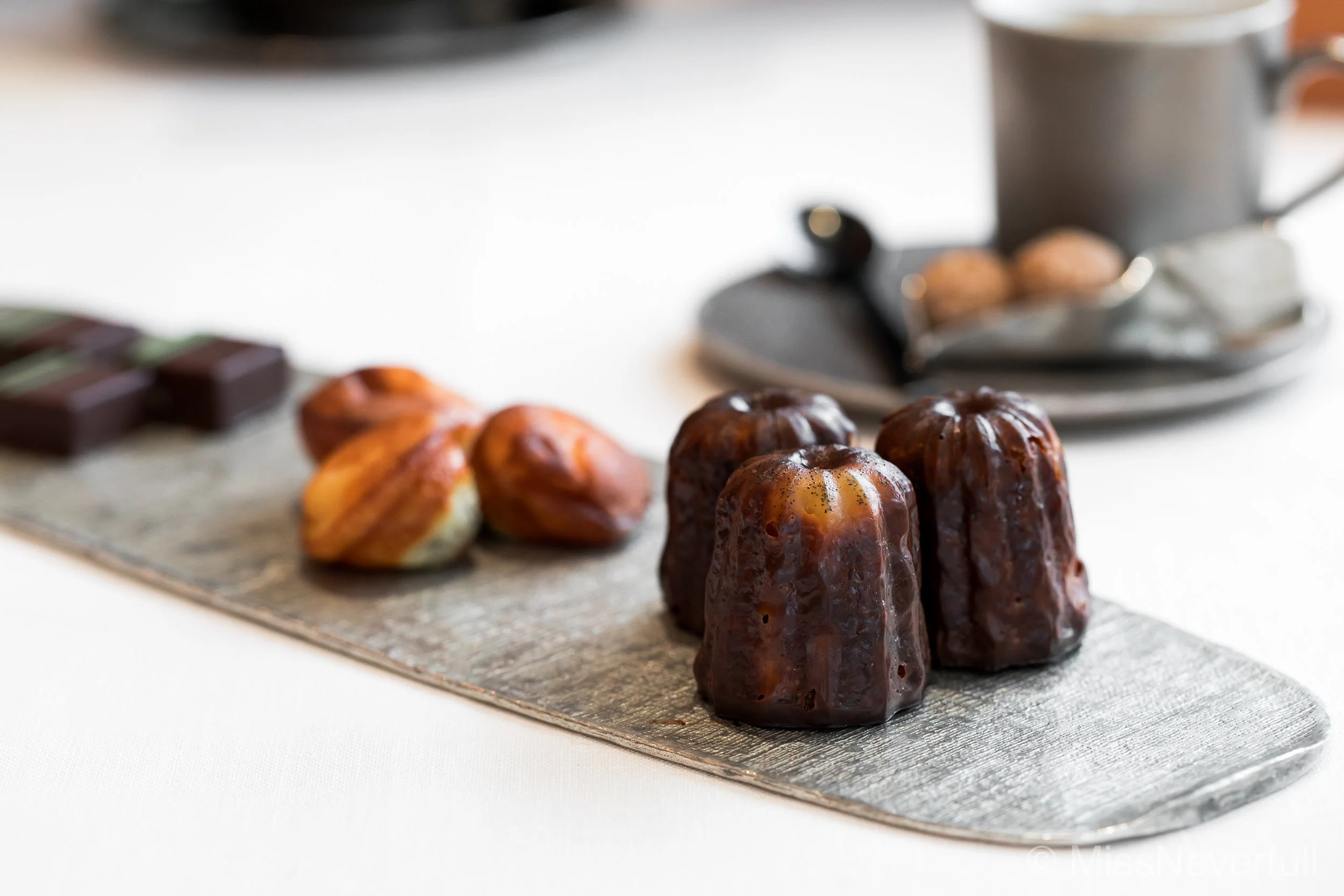 Petit fours: Canele, madelines, and chocolates. Served with your choice of Coffee/Tea. 