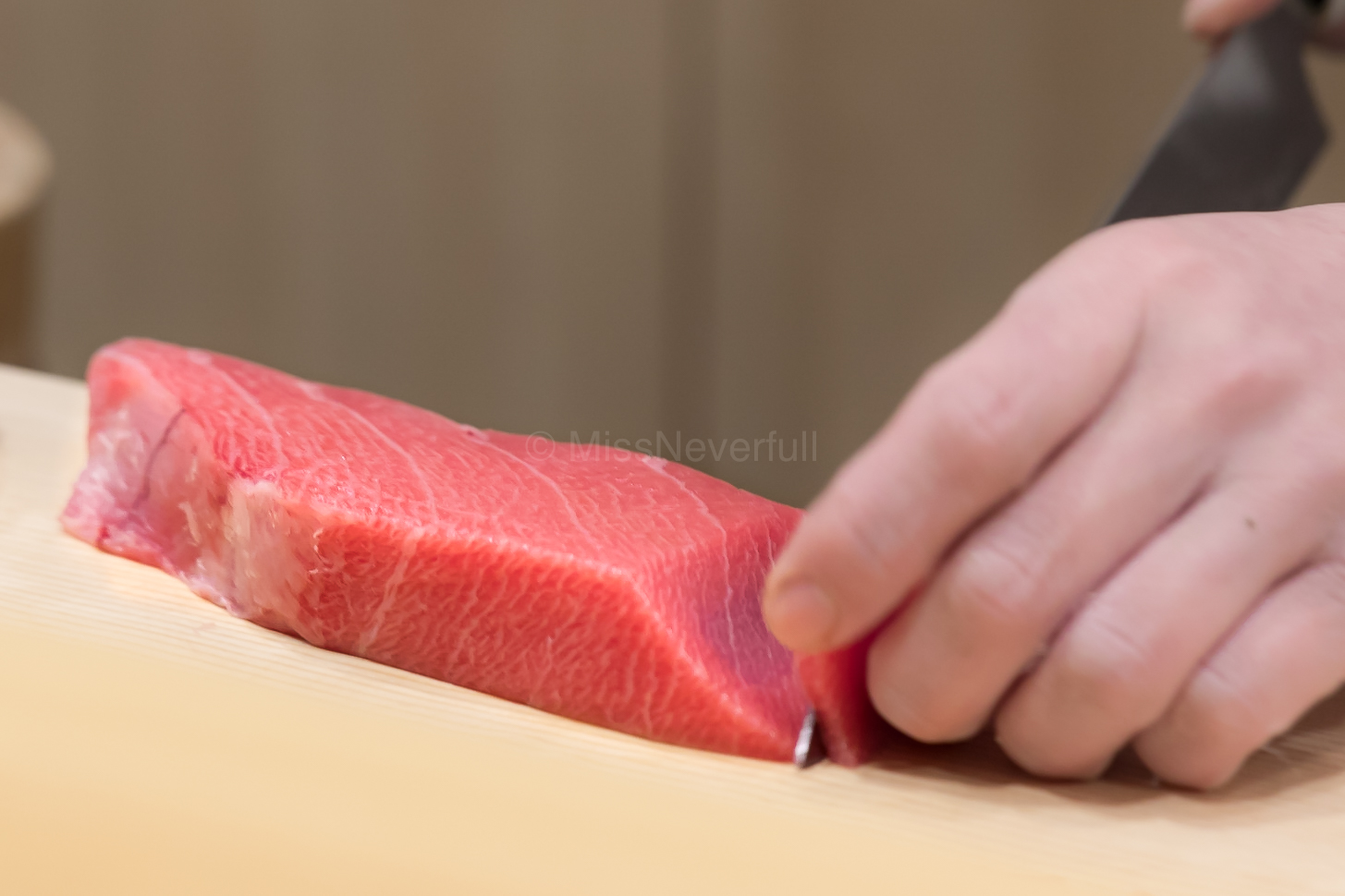 Chef Arai-san slicing maguro