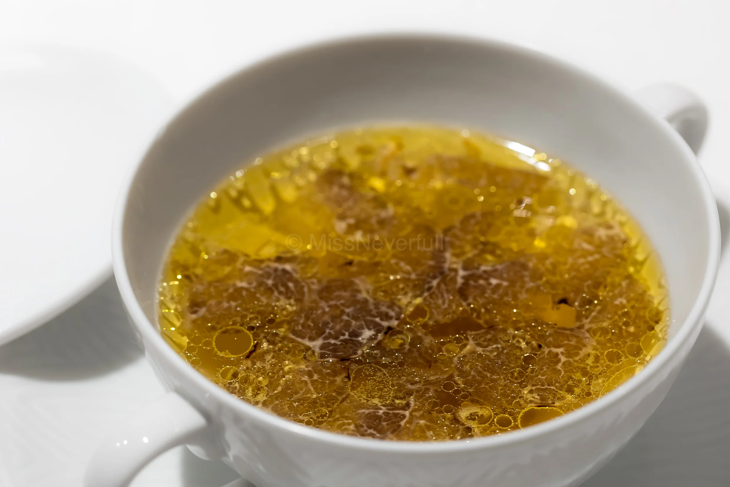 Winter | Consomme of Jinhua ham and Gifu ham, free-range chicken and black truffle