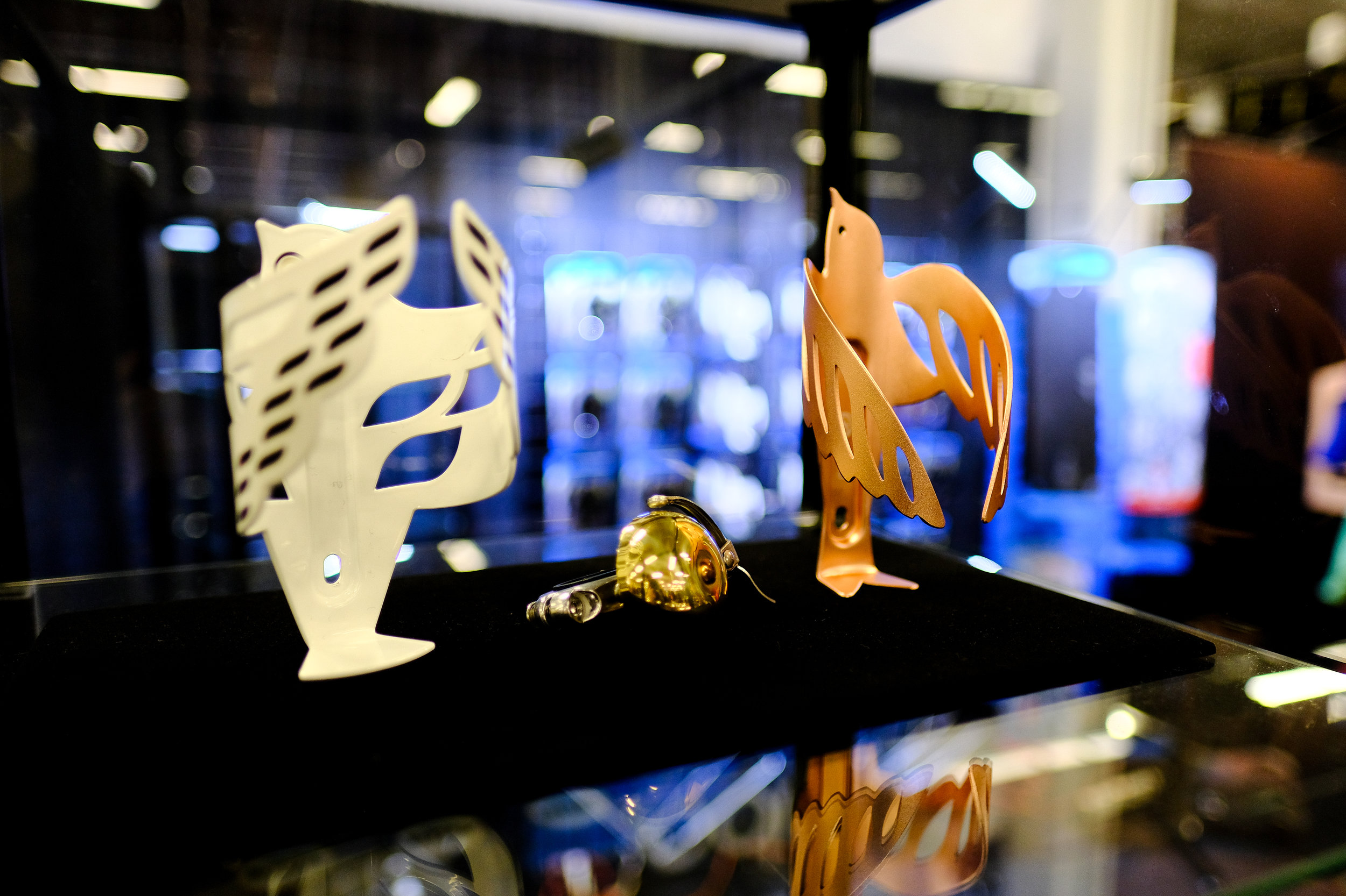 PDW always has fun little gadgets on display, in this case metallic bird-shaped bottle cages!