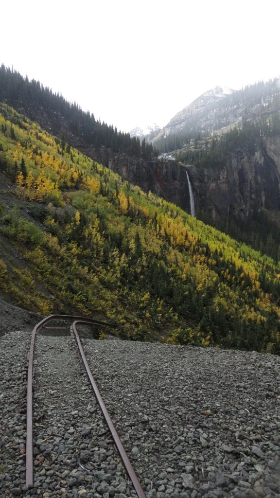 Rails go off the cliff! Note the DC power plant in the background, running off the water power.