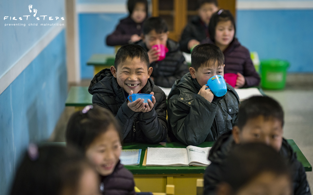 At the boarding school, there are smiles all around during the morning soymilk break.