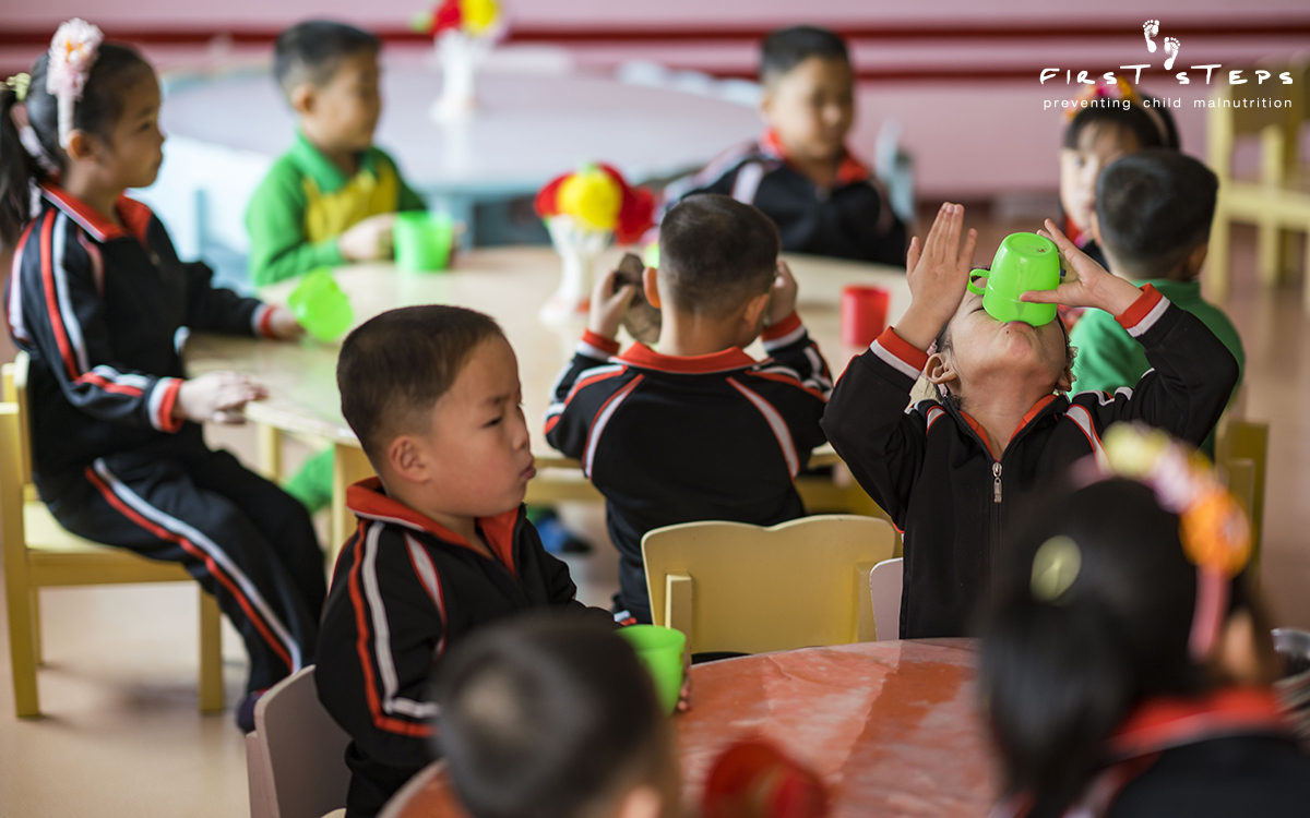 One of the beneficiaries of the soymilk produced at the Nampo Foodstuff Factory is the Nampo Kindergarten Orphanage. The children enjoy their soymilk - right to the very last drop!