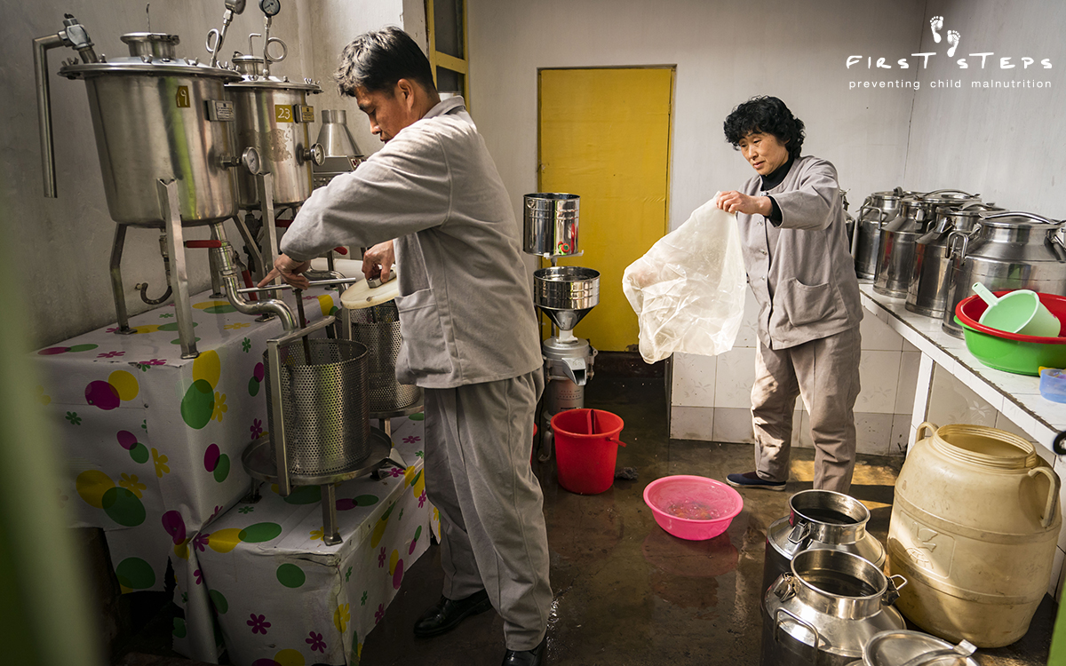 Cleaning up after finishing the day's soymilk production at the Hanggu Daycare and Kindergarten Supply Centre in Nampo.