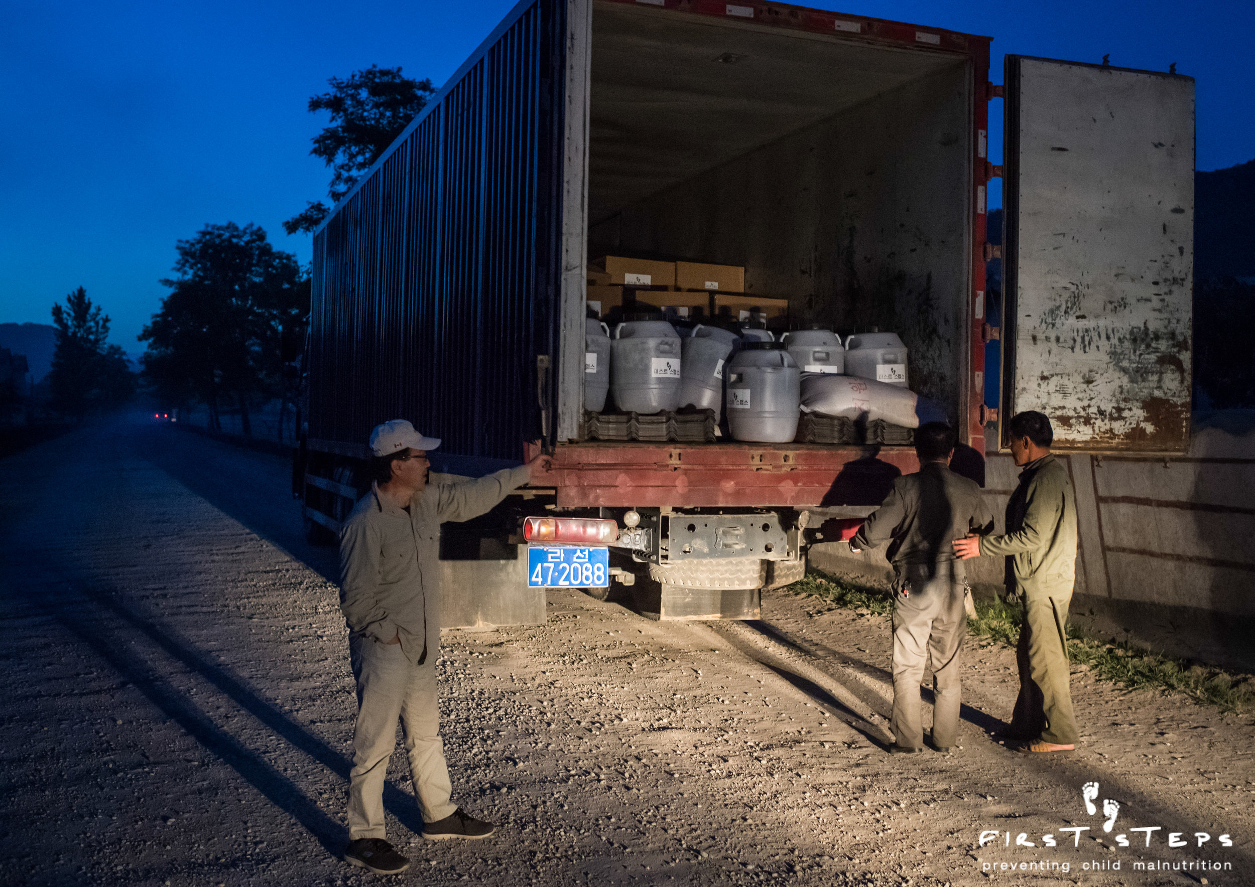 A truck carries First Steps’ food aid and roofing to Yonsa.