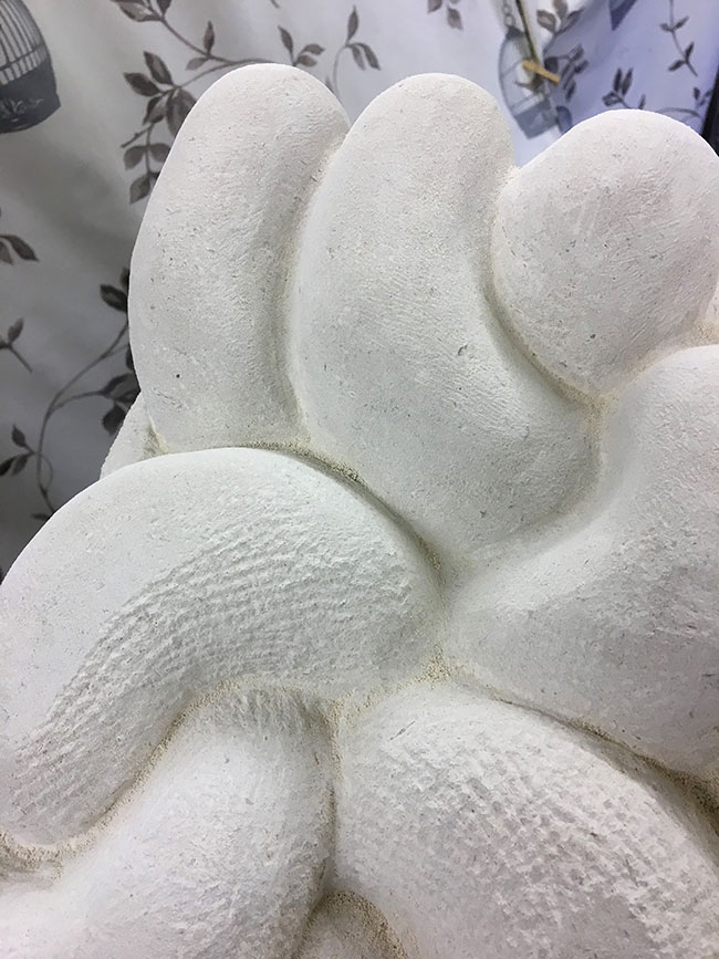 You can see the marks made by the claw chisel here. The teeth create these ridged marks which have been smoothed down with rasp and rifllers on the shapes above (which Julia calls Wotsits).