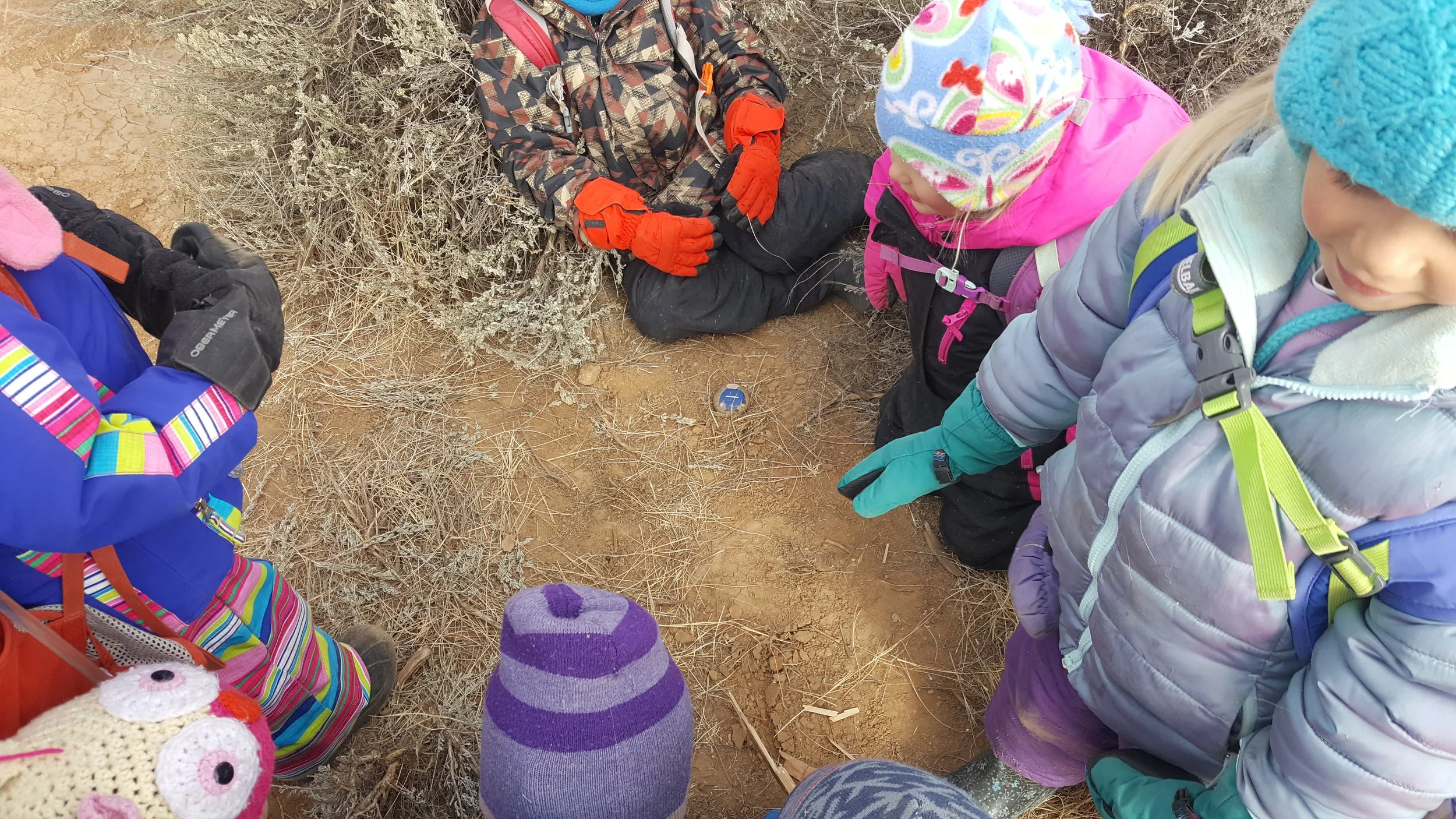 Gnome minus. His brother, gnome plus, is red. Every time we stop, we do counting or subtraction games.