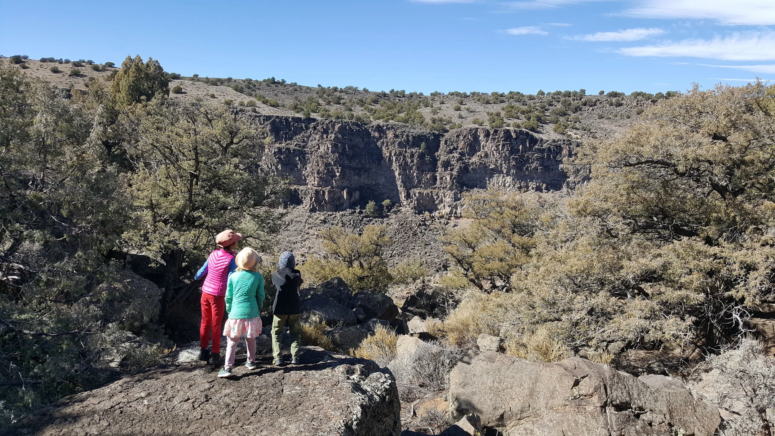 A view from inside Bone Canyon. These kids are shouting into the distance from Echo Rock. The cliffs in the distance provide an amazing 5-second delay crystal clear echo.