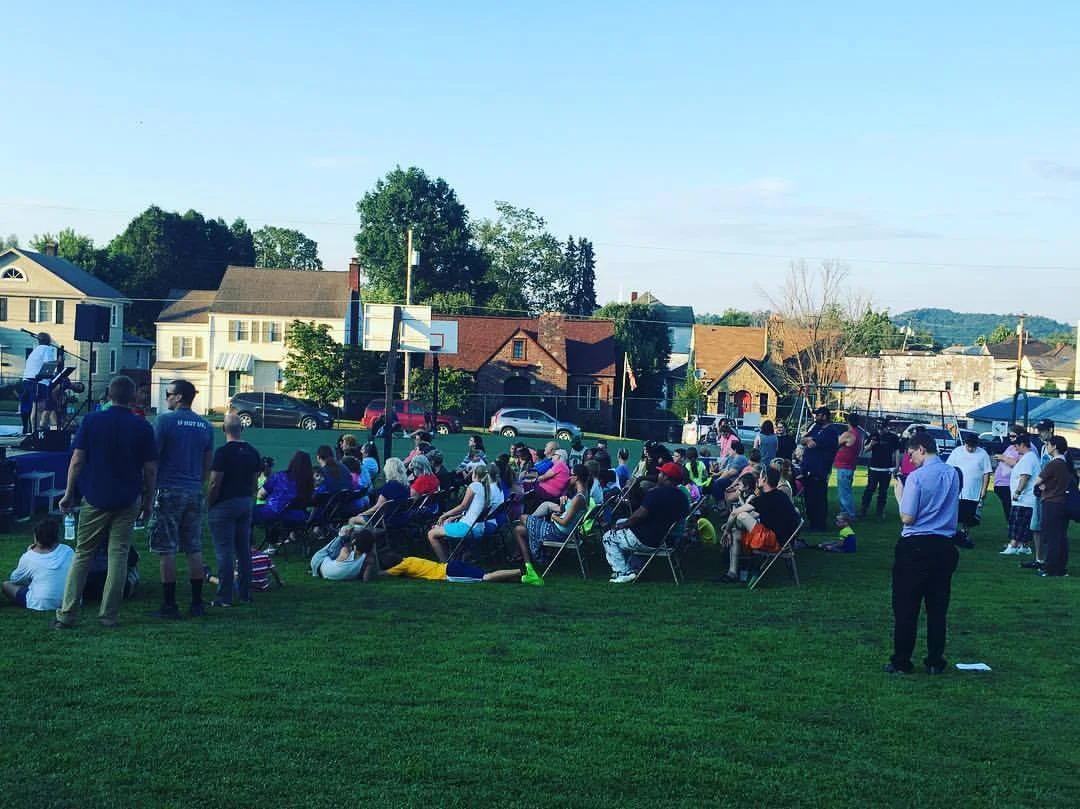ALIVE in Stealey Park July 2017 Elevate Youth's second year back at Stealey Park in Clarksburg! They gave away free food boxes, had inflatable games, face painting, and giveaways - and Christ was preached loudly!