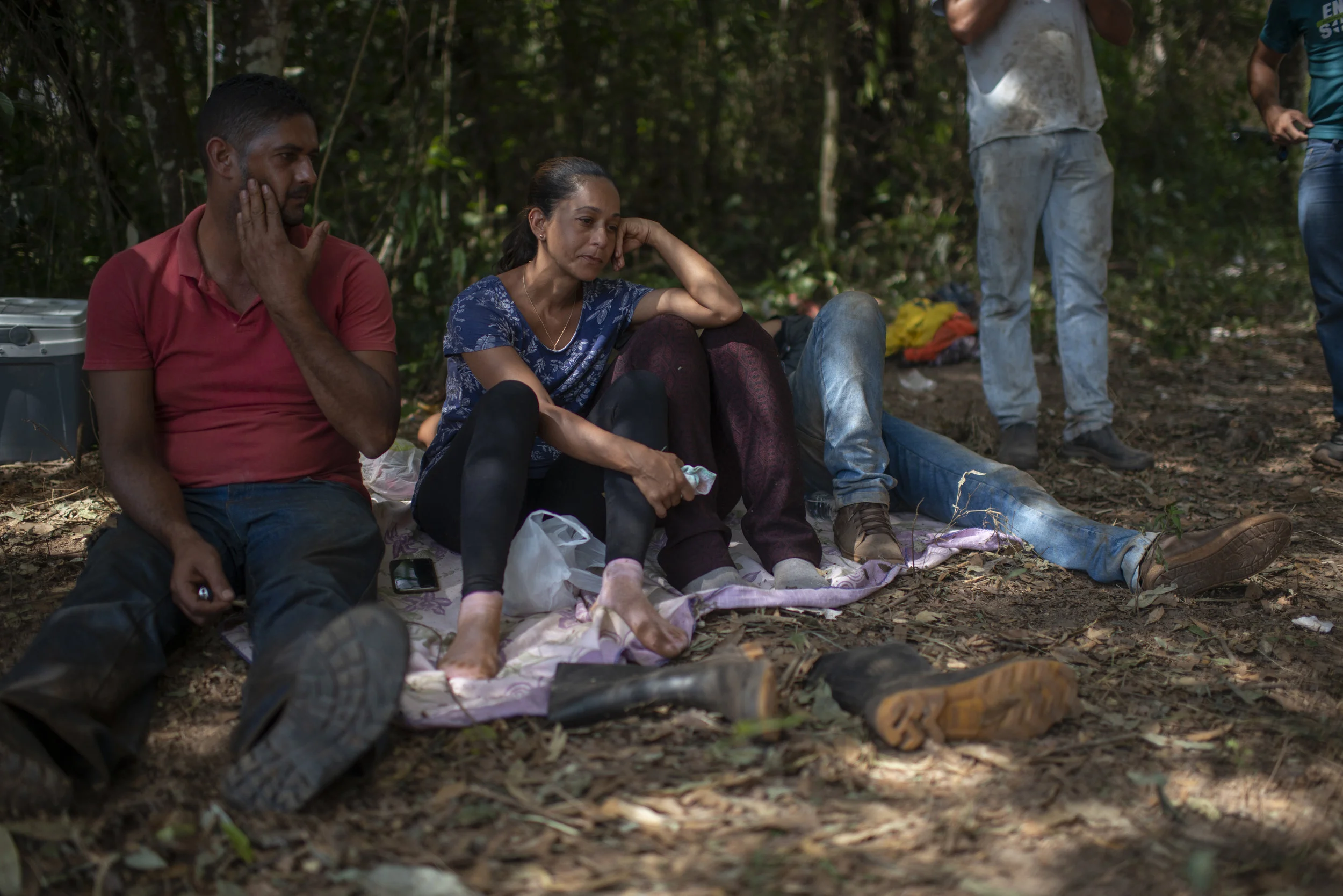  Relatives take a break during their search for a family member who disappeared in the disaster. “Hope is the last thing to die in a man, but it’s gradually disappearing,” said Ivelton Martins, a 30-year-old engineering student who has been digging t