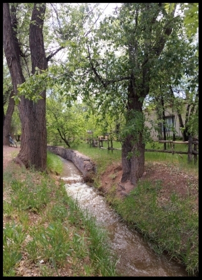 The city's main acequia runs through the historic Eastside neighborhood, next to Canyon Road