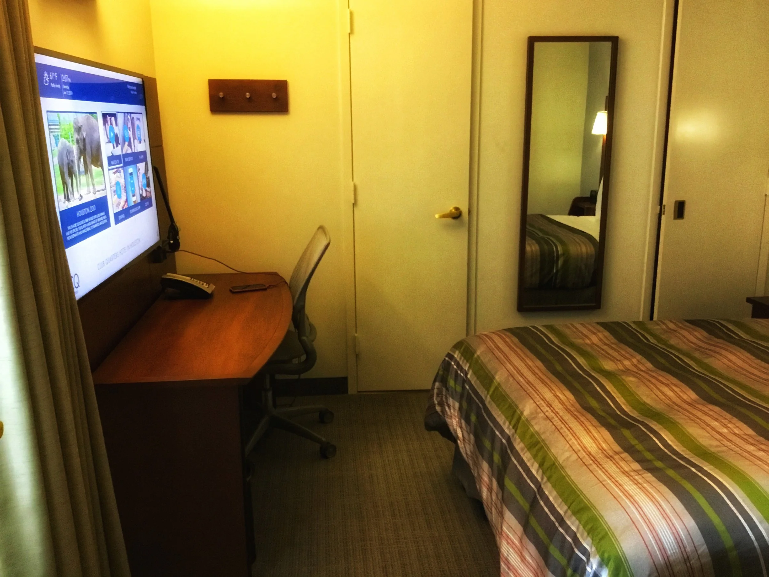 Desk with door to the bathroom (the closet is the door on the right side of the mirror).