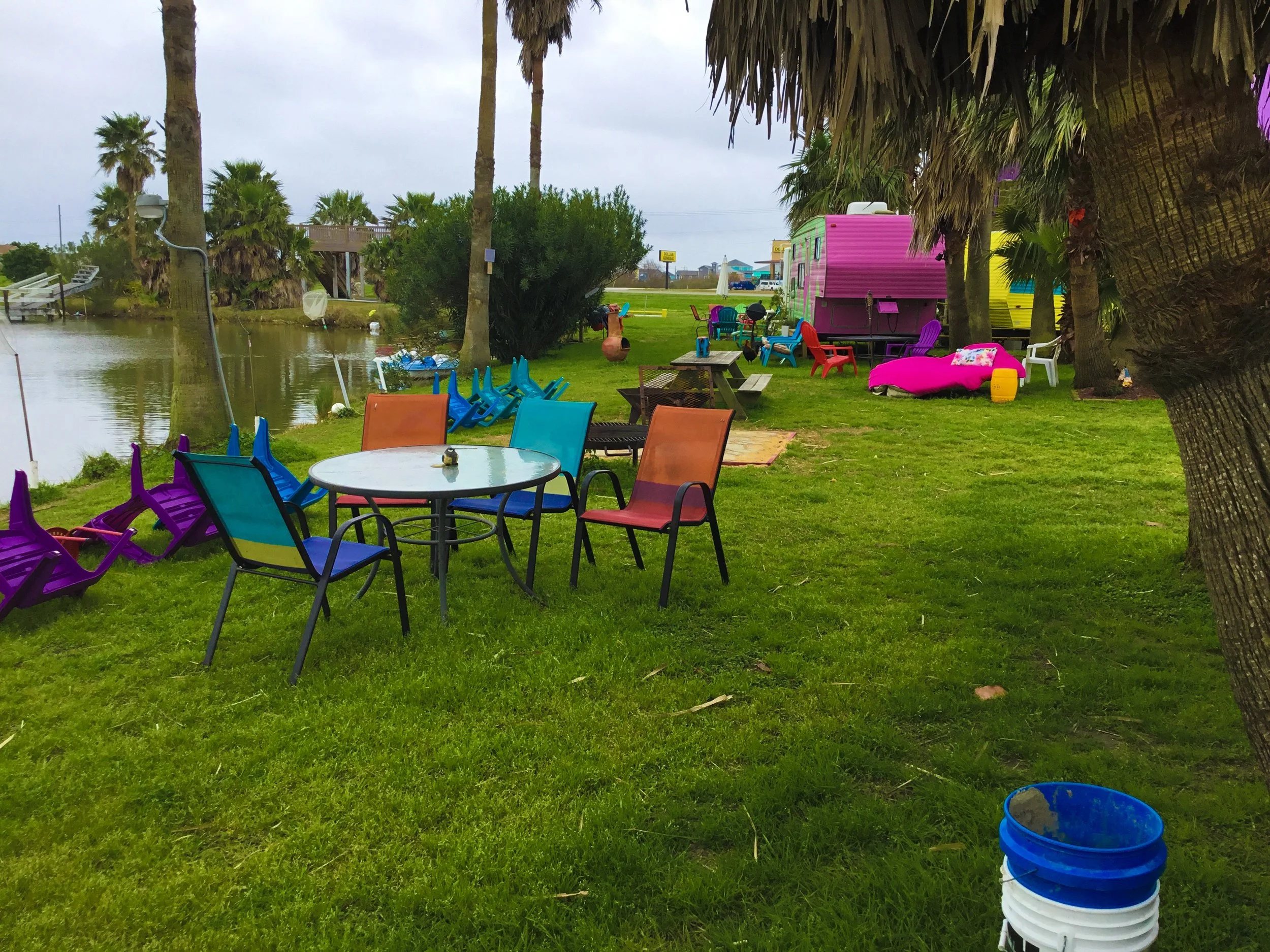 Tables, chairs, fire pits, and grills are common near all of the units.