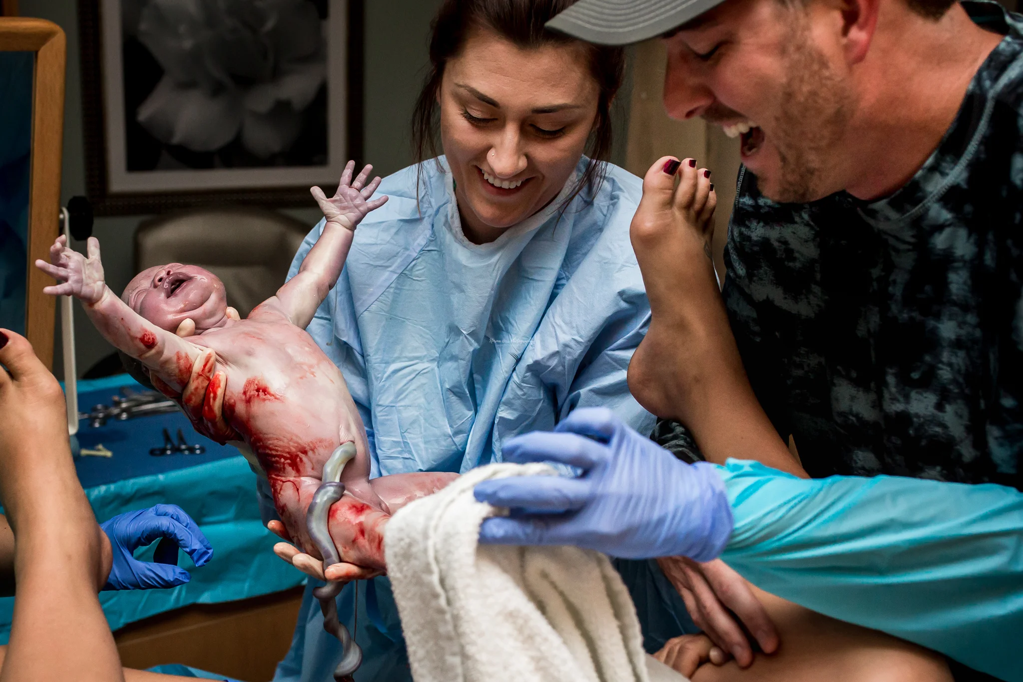 Midwife (Simone Payan, CNM) and Dad learn baby's gender. Edinburg Texas Birth. Happy International Day of The Midwife. | rgvbirthphotography.com | Norma Hess Photography