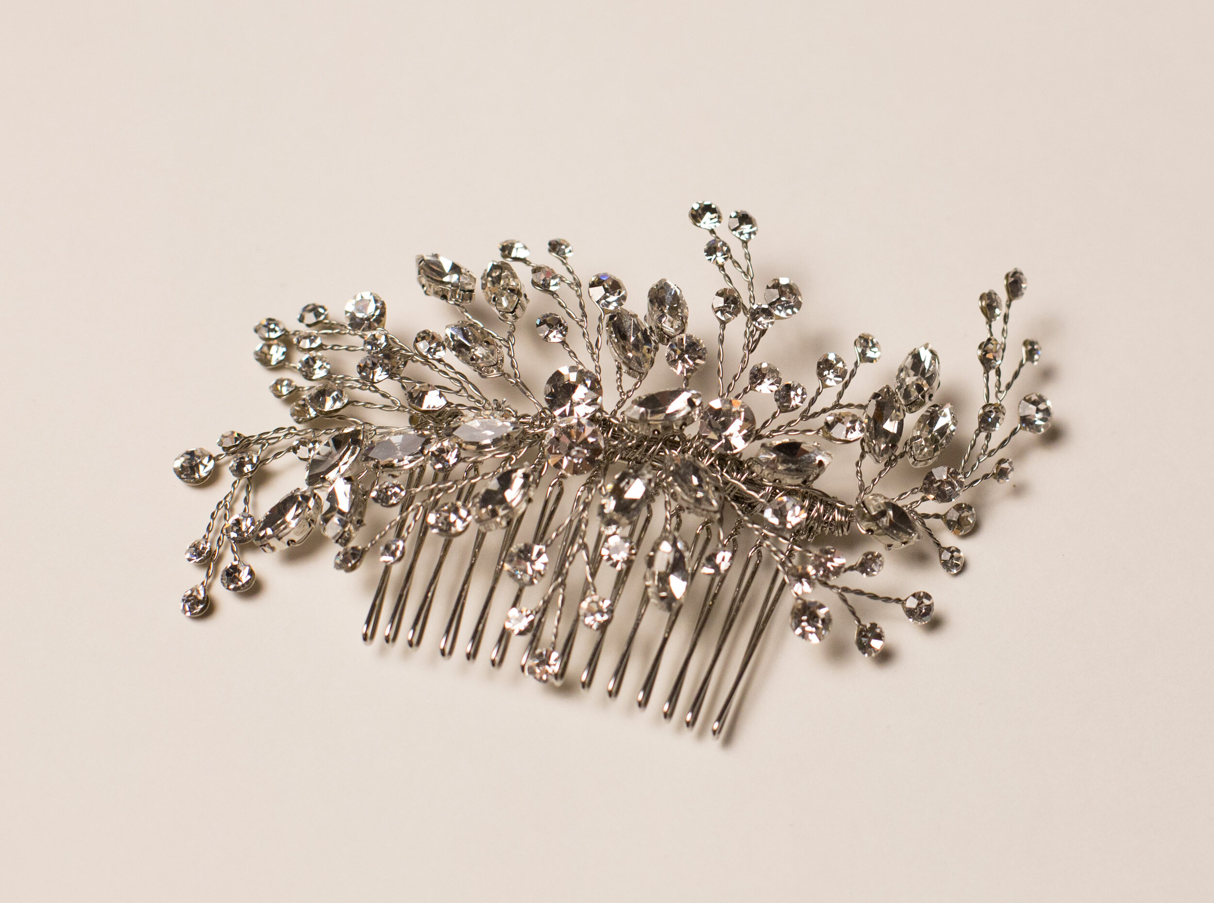 Julienne (Silver), bridal hair comb is intricately designed with the finest Swarovski crystals.
