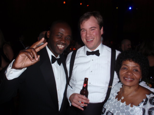   My mom and I sharing a moment with the bridegroom, Bobby Buckley, at the wedding reception in New York's Four Seasons Hotel on October 22, 2011. My mom helped raised the bride, Milano, in West Harlem.    