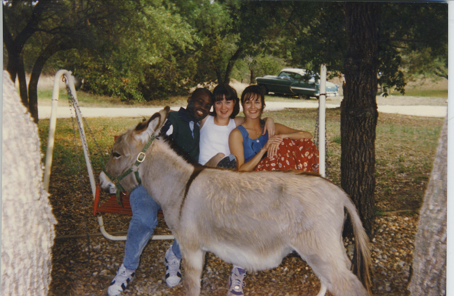   During the early 1990s, I was in a long-distance relationship with a young woman (center) who lived in Austin, Texas. She took me to see her sister's family -- and their goat. I'm glad I got back alive!    