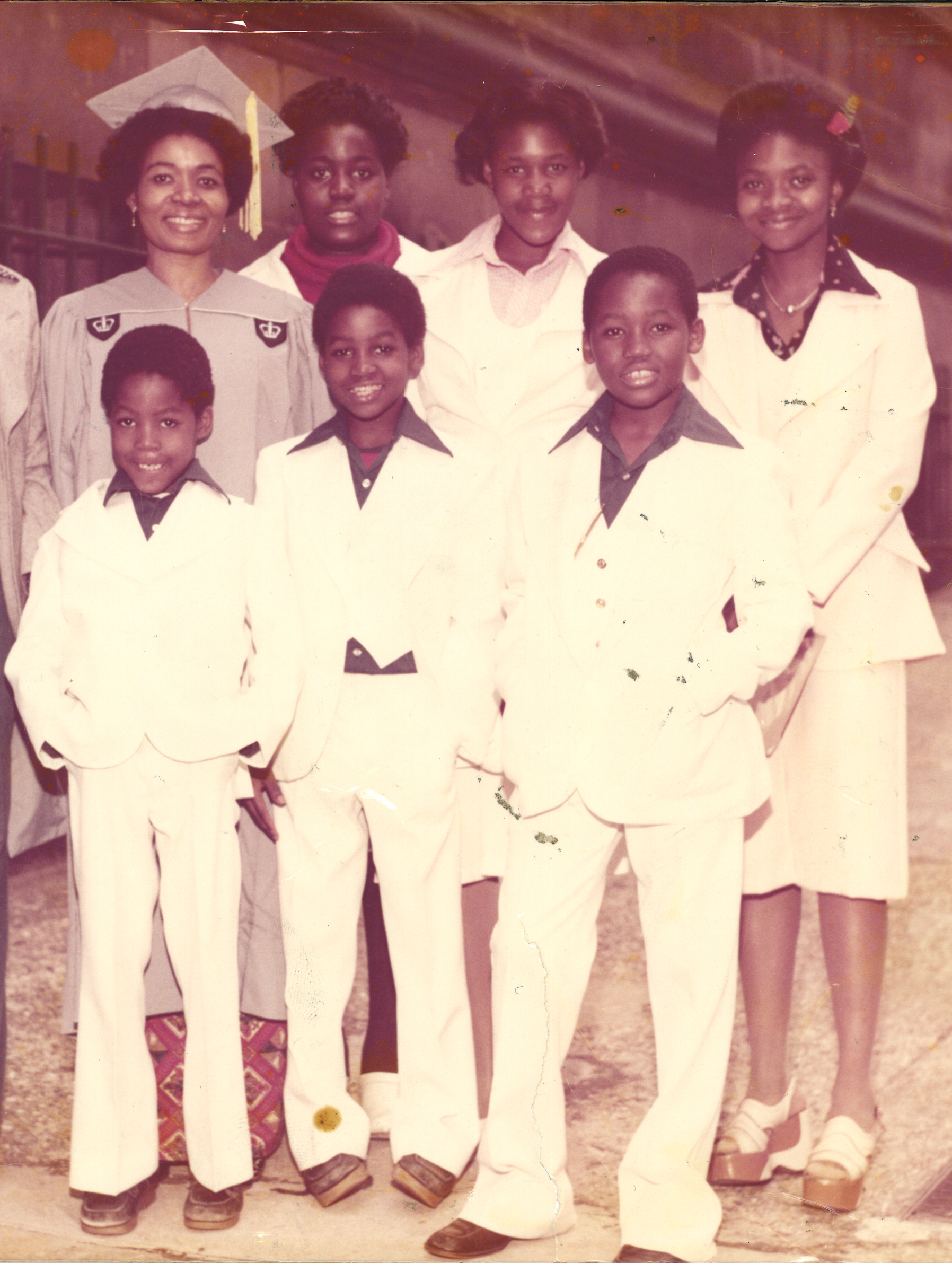   Dorcas Demasio, her five children and her niece (far right) after the matriarch overcame enormous odds to obtain a graduate degree from Columbia University in 1977. Queen Dorcas, also an alumna of New York University, ended up with three degrees.  