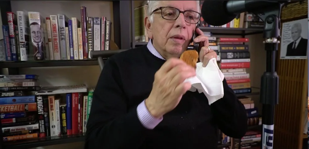 Pre-interview: David munches on an oatmeal cookie while checking on his voicemail.