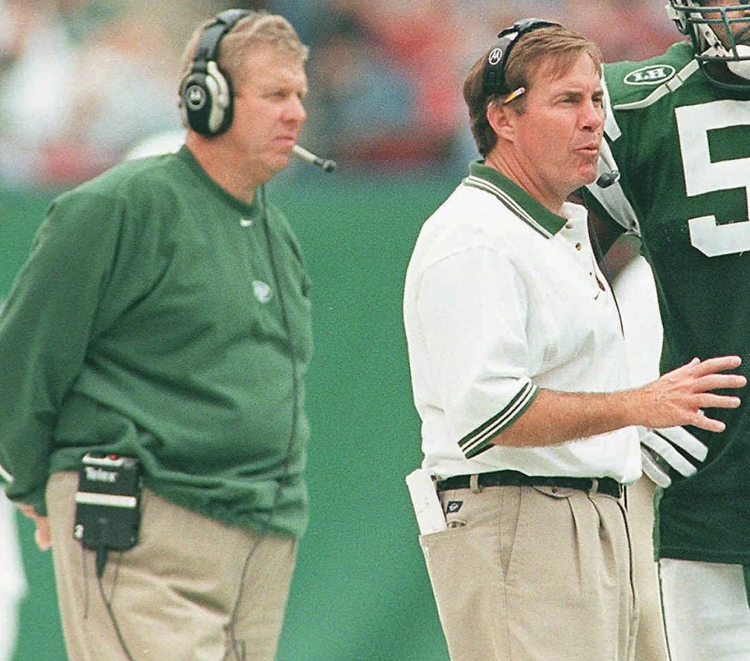 BIll Parcells's disciples starred yet again in the NFL playoffs: Mike Zimmer's Vikings defeated Sean Payton's Saints to reach the NFC Championship. And Tom Coughlin's Jaguars made an improbable trip to the AFC Championship. Perhaps fittingly, Parcells's most famous student, the great Bill Belichick, emerged from the pack to reach his latest Super Bowl, enhancing an unparalleled career. During 14 of 19 seasons learning under the NFL's godfather, Belichick underwent a mutually beneficial and complicated relationship. In early 2000, the partnership reached a turning point that would impact the fate of NFL franchises and future Super Bowls. This article revisits the palace intrigue, betrayal -- and then reconciliation -- first revealed in the New York Times bestseller Parcells: A Football by Nunyo Demasio and Bill Parcells. In the above image, Belichick instructs his Jets defense during an October 17, 1999, victory over Indianapolis at Giants Stadium. As usual, Parcells stands close by. Little Bill, though, inevitably escaped Big Bill's shadow, spurning a succession plan to make him Jets head coach. And the rest became football history: Belichick setting Super Bowl records in New England; Parcells going on to mold future head coaches who would use those lessons to win their share of Lombardi trophies. (Image: John T. Grelick, AP)