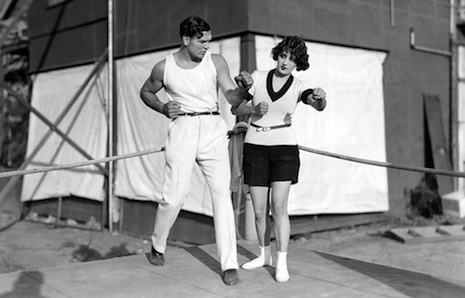 Jack Dempsey teaches his Wilmington bride, Estelle Taylor, a few boxing moves.
