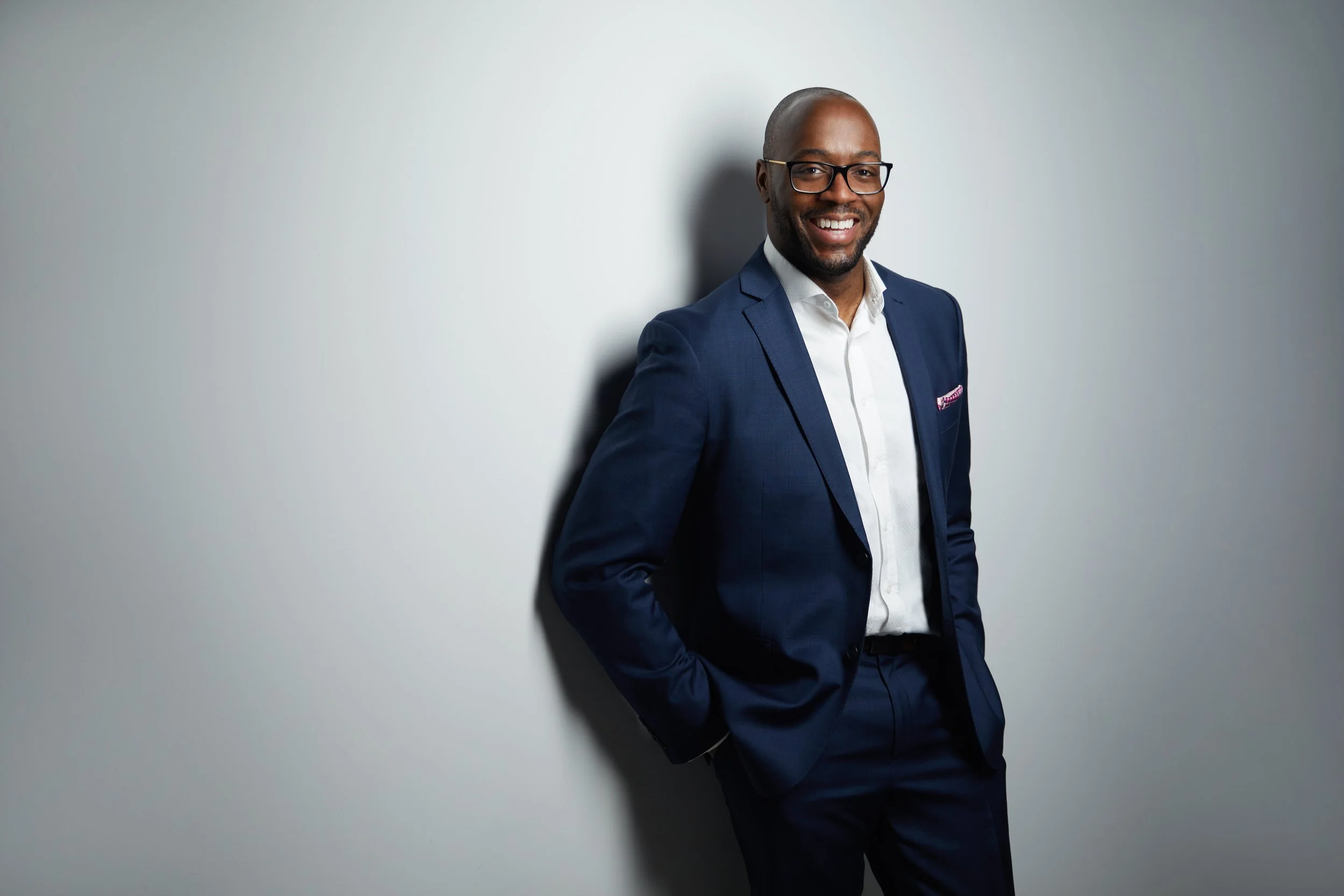 Nathan Walters, business portrait in a suit against a white studio backdrop, Edmonton corporate headshot photography