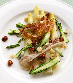 asparagus with lardo, parmesan and toasted hazelnuts