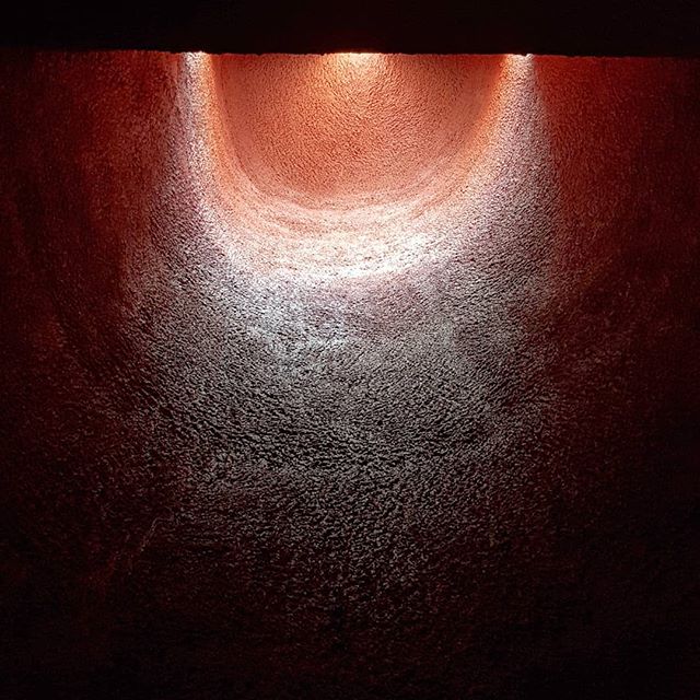 Looking up,  within one of the three chapels at #notredameduhaut - this one's curved walls are painted red, possibly as a reference to both the sacrifice of Christ and that of the soldiers who fired in 1944 (which s when the old chapel was destroyed 