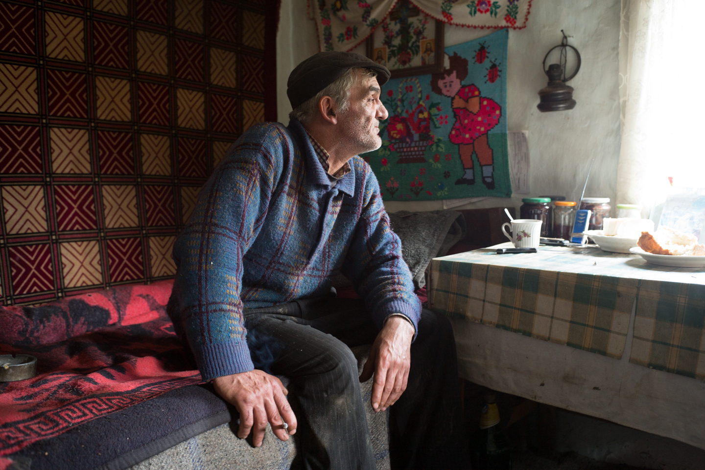  Elderly farmer at home, Voineasa, Romania 