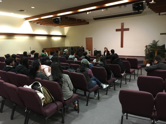 Faith, from Alpha Pregnancy Center, sharing to the two small groups. 
