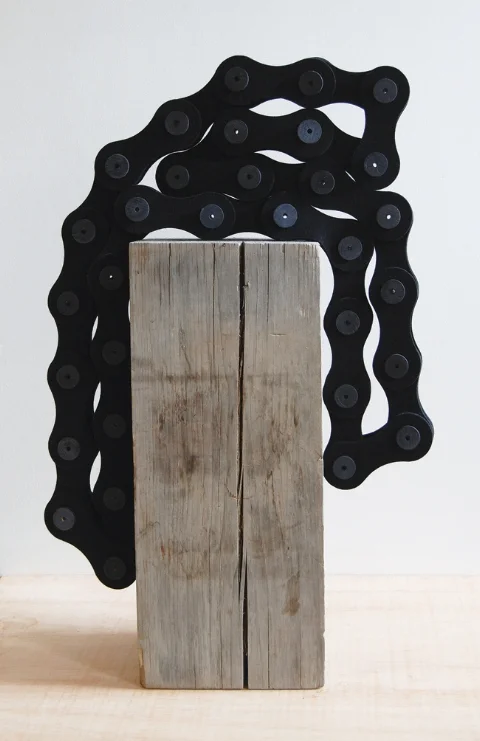    Large Black Chain Over Beam,&nbsp;   2012 |&nbsp;Felt, wooden spools and   recycled wood beam  &nbsp;|&nbsp;Dimensions variable  