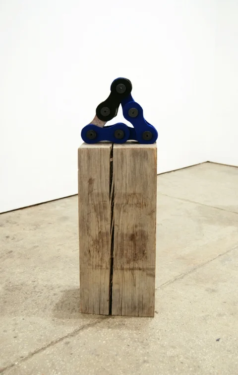    Black and Electric Blue Triangle Chain,&nbsp;   2012 |&nbsp;Felt, wooden spools and   recycled wood beam  &nbsp;|&nbsp;Dimensions variable  
