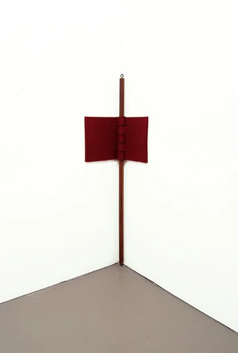    Red Hinge   , 2011 | Felt, thread and wood pole | Just felt piece: 54 x 30 x 8 cm - Final dimension is variable depending on wood pole length     